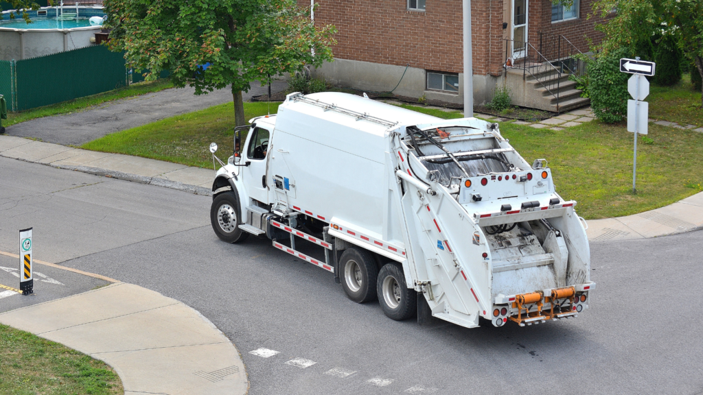 a white dumpster across the street