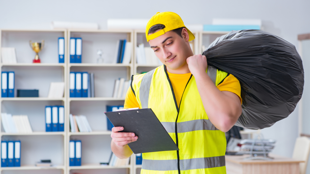 A sanitation worker checking the list