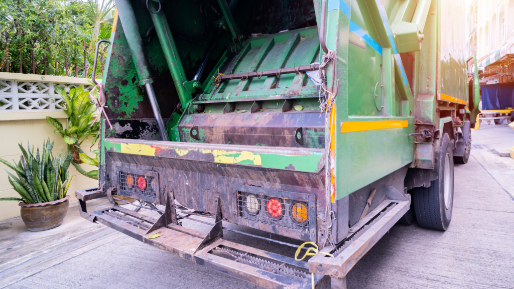 green dumpster truck