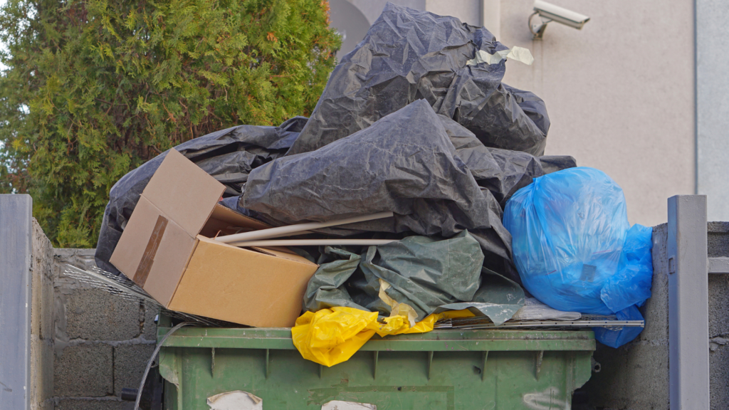 an open lid dumpster