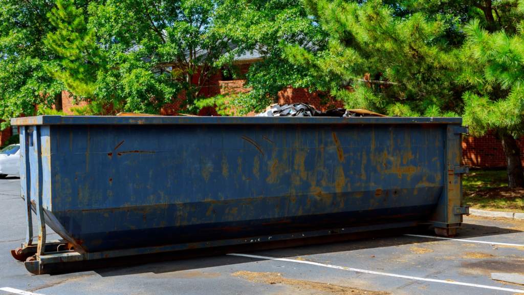 a blue rusty dumpster