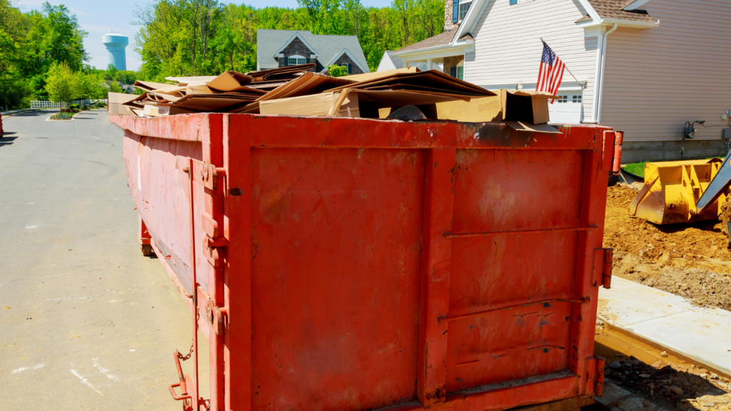 A large, industrial dumpster loaded with waste